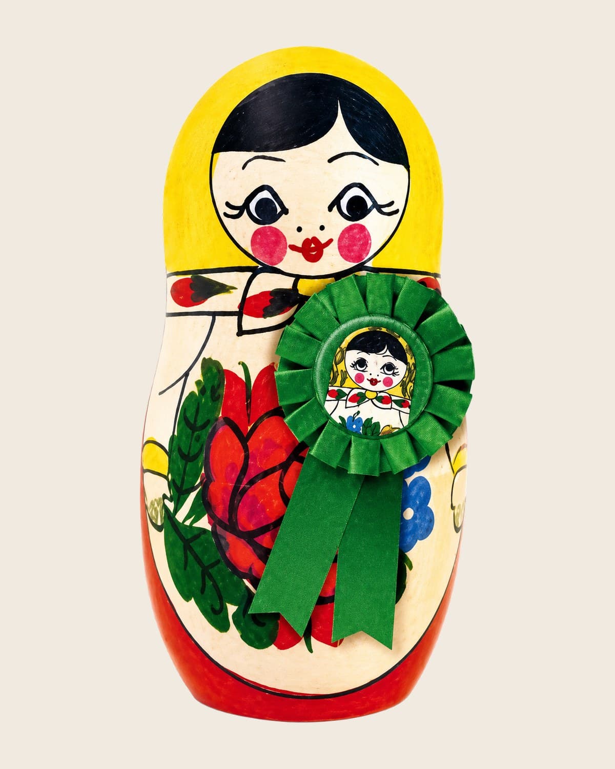 A Lequin nesting doll holding an accreditation rosette — every coach is ICF accredited